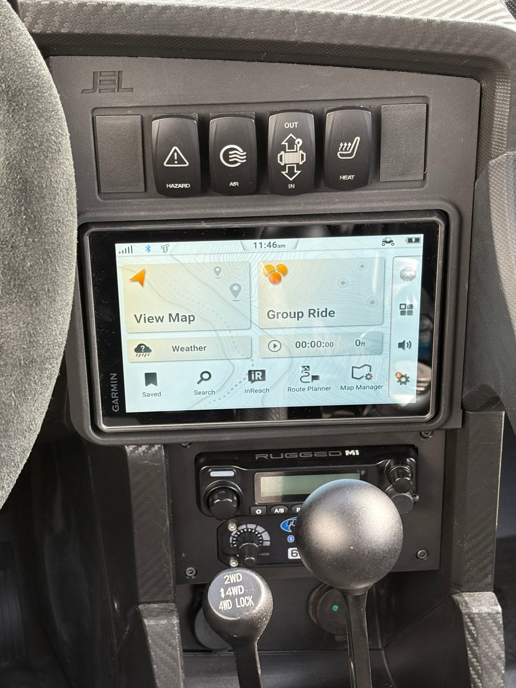 Image of JEL-Design Dash Panel mount for Garmin Tread 2 installed in the upper dash opening together with the Rugged Radios M! or G1  and intercom installed in the lower dash opening of a Speed UTV. OEM-style Factor installed look,  Elevate your ride.  Built for the Ride.